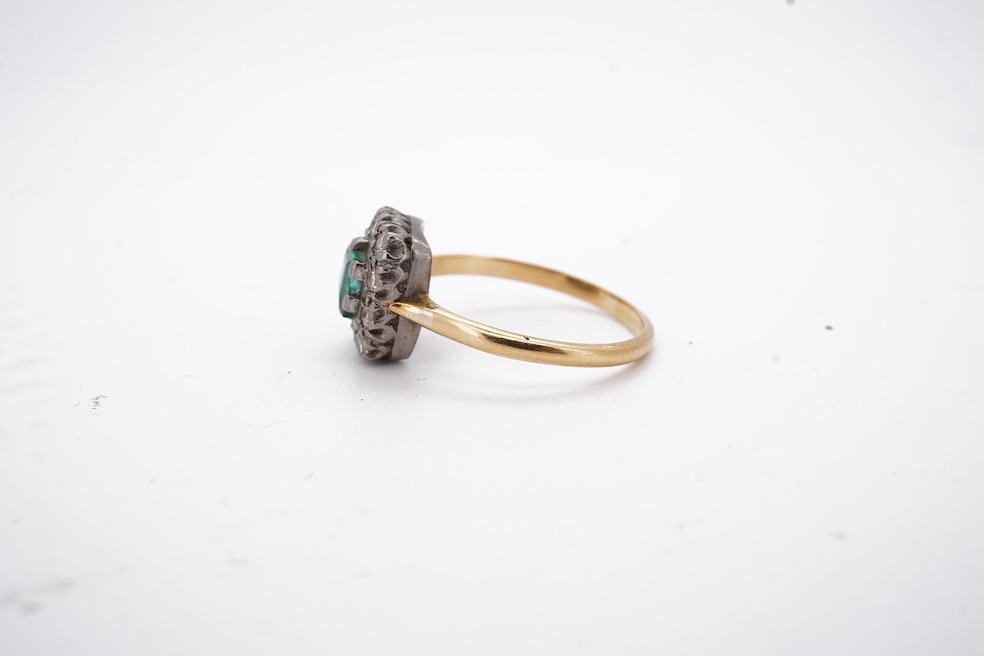 An early to mid 20th century yellow metal, emerald and diamond set rectangular cluster ring, size R, gross weight 3.5 grams. Condition - poor to fair